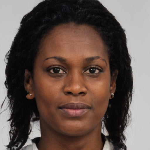 Neutral black young-adult female with long  black hair and brown eyes