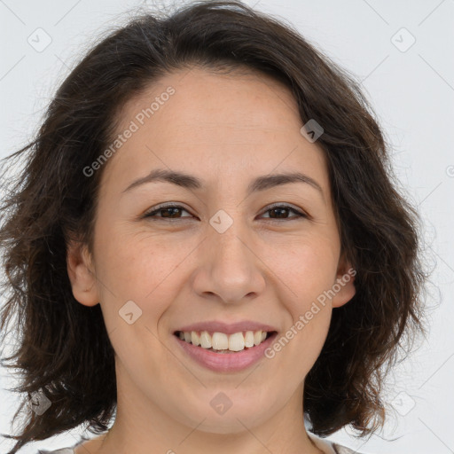 Joyful white adult female with long  brown hair and brown eyes