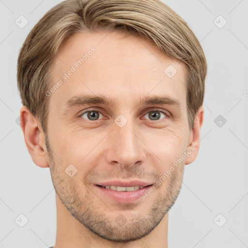 Joyful white young-adult male with short  brown hair and grey eyes