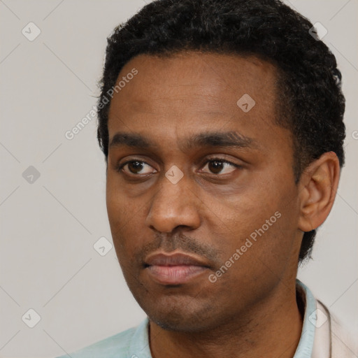 Neutral black young-adult male with short  black hair and brown eyes