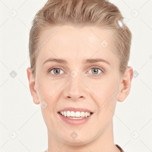 Joyful white young-adult female with short  brown hair and grey eyes