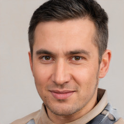 Joyful white young-adult male with short  brown hair and brown eyes