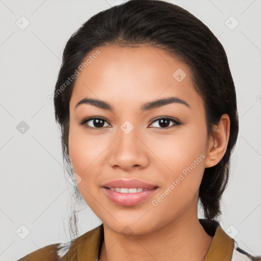 Joyful latino young-adult female with medium  brown hair and brown eyes