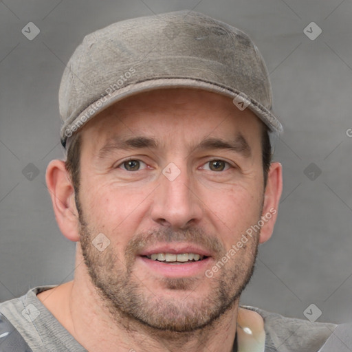 Joyful white adult male with short  brown hair and grey eyes