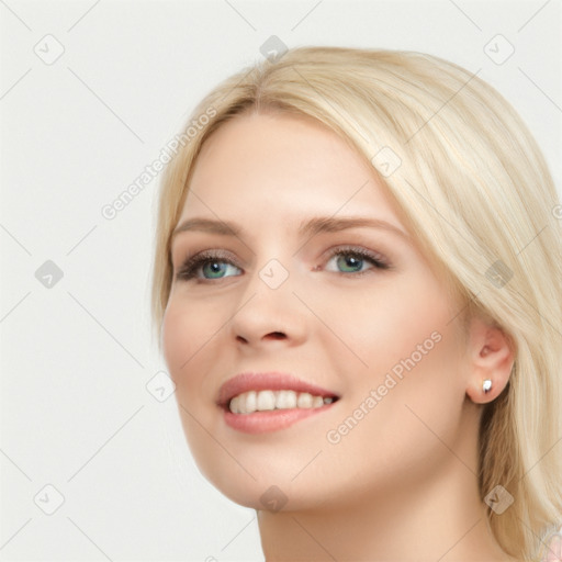 Joyful white young-adult female with long  brown hair and blue eyes