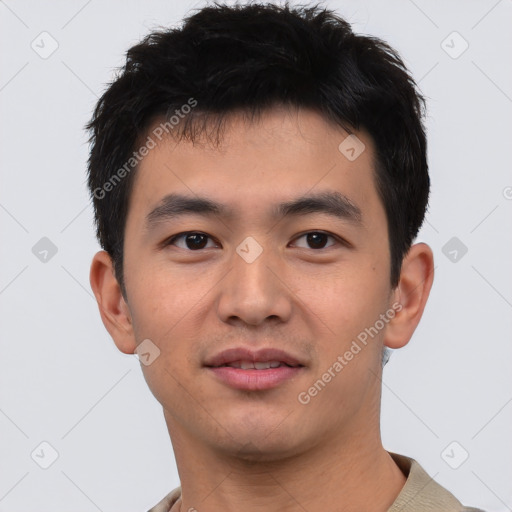 Joyful asian young-adult male with short  black hair and brown eyes