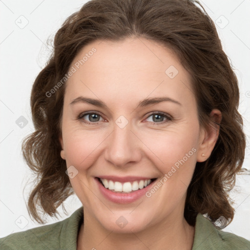 Joyful white young-adult female with medium  brown hair and green eyes