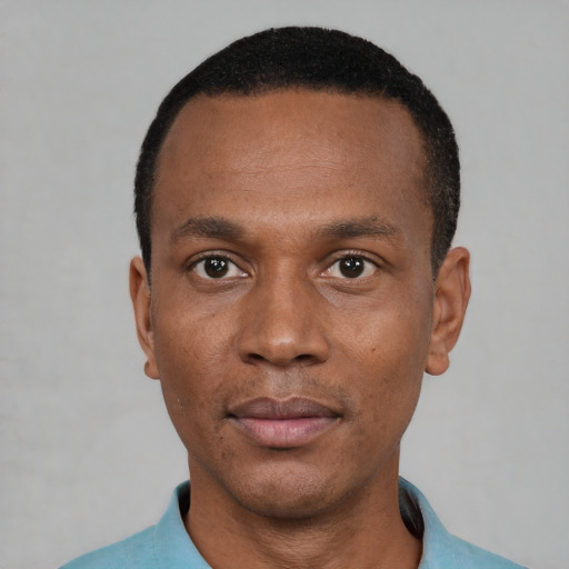 Neutral black adult male with short  black hair and brown eyes