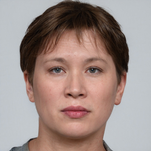 Neutral white young-adult female with short  brown hair and grey eyes