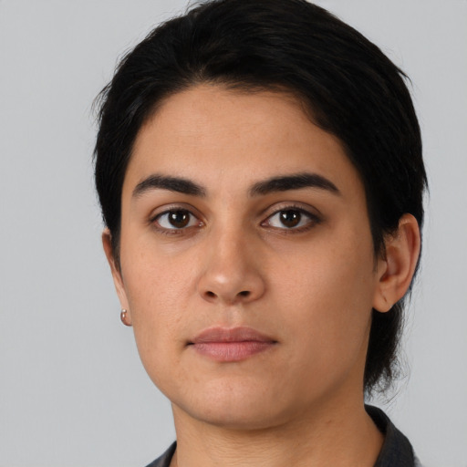 Neutral latino young-adult female with short  black hair and brown eyes