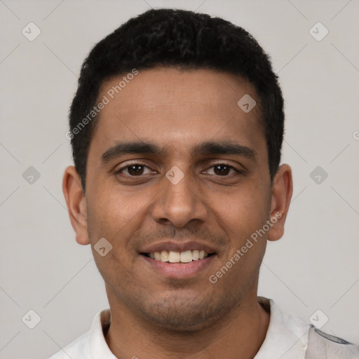 Joyful latino young-adult male with short  black hair and brown eyes