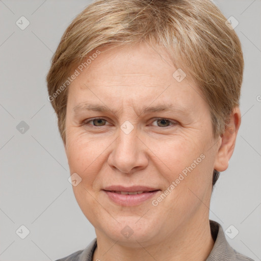 Joyful white adult female with short  brown hair and grey eyes