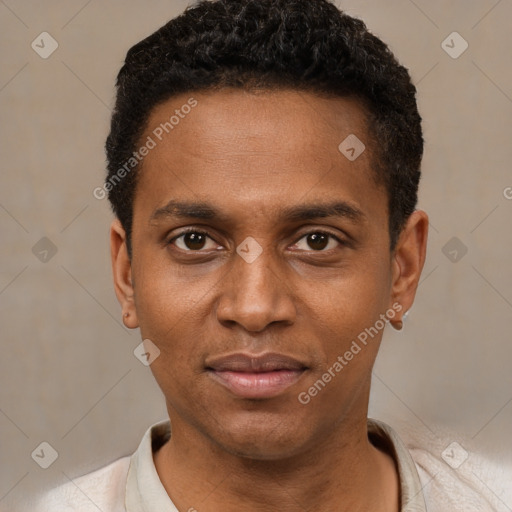 Joyful black young-adult male with short  black hair and brown eyes