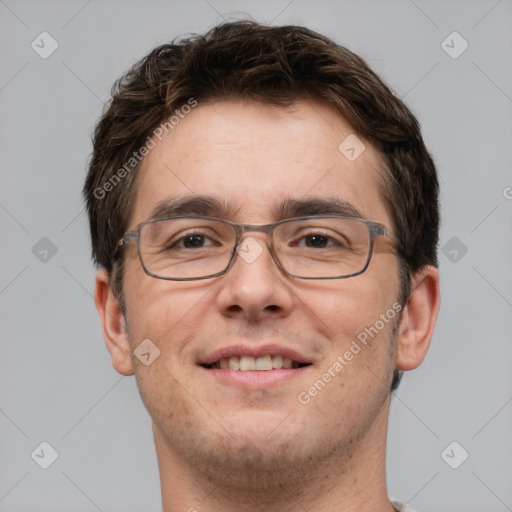 Joyful white adult male with short  brown hair and brown eyes