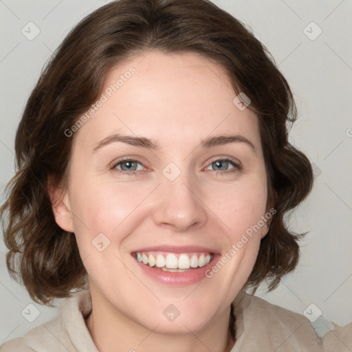 Joyful white young-adult female with medium  brown hair and blue eyes