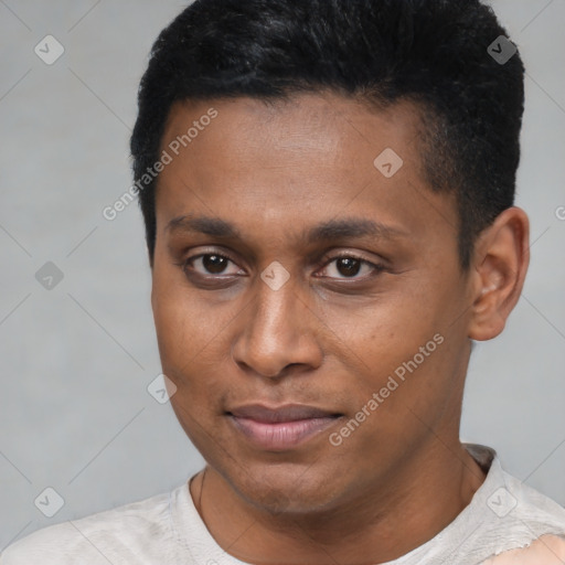 Joyful latino young-adult male with short  brown hair and brown eyes