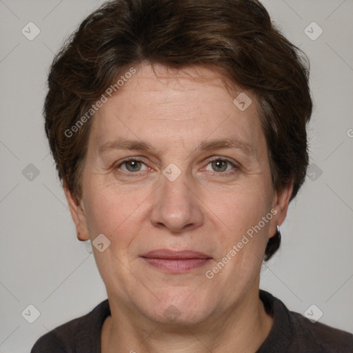 Joyful white adult female with short  brown hair and grey eyes