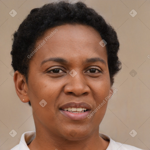 Joyful black adult female with short  brown hair and brown eyes