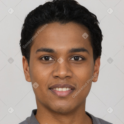 Joyful black young-adult male with short  black hair and brown eyes
