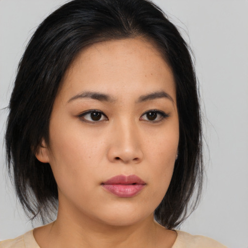 Neutral asian young-adult female with medium  black hair and brown eyes