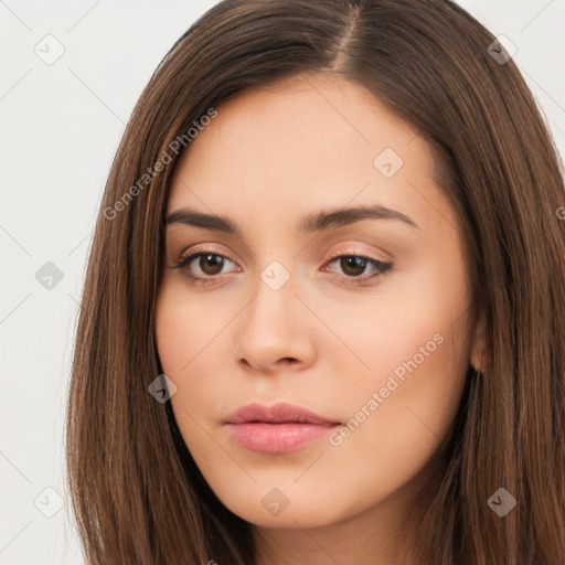 Neutral white young-adult female with long  brown hair and brown eyes