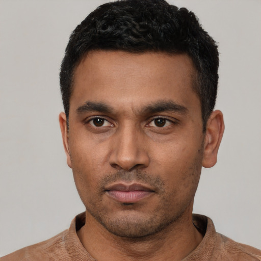 Neutral latino young-adult male with short  black hair and brown eyes
