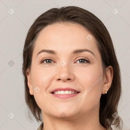 Joyful white young-adult female with medium  brown hair and grey eyes