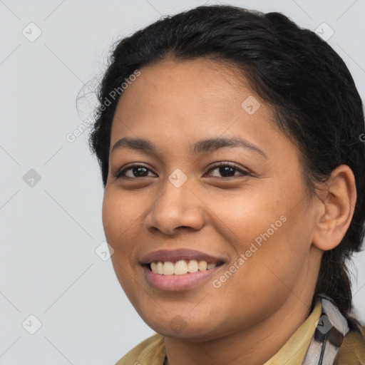 Joyful latino young-adult female with long  brown hair and brown eyes