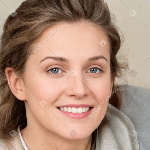 Joyful white young-adult female with long  brown hair and blue eyes