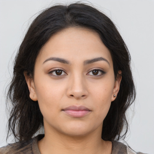 Neutral latino young-adult female with long  brown hair and brown eyes