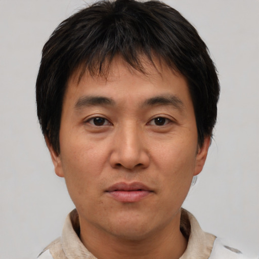 Neutral asian young-adult male with short  brown hair and brown eyes
