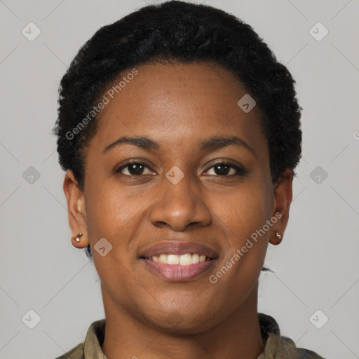 Joyful black young-adult female with short  black hair and brown eyes