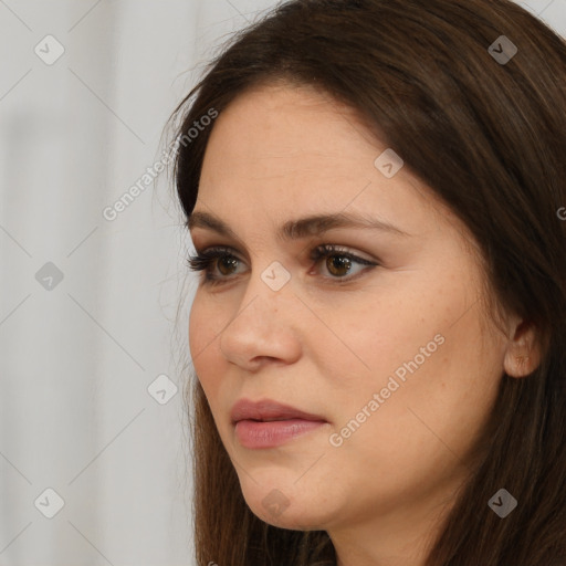 Neutral white young-adult female with long  brown hair and brown eyes