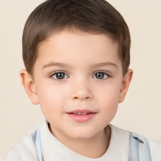 Joyful white child male with short  brown hair and brown eyes