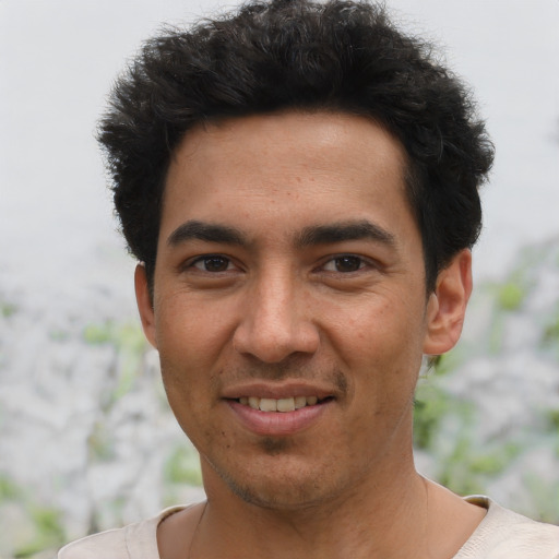 Joyful asian young-adult male with short  black hair and brown eyes