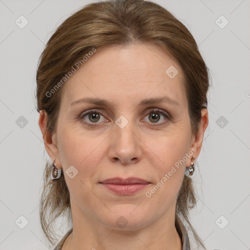 Joyful white adult female with medium  brown hair and grey eyes