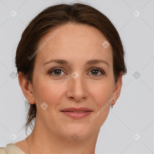 Joyful white adult female with short  brown hair and grey eyes