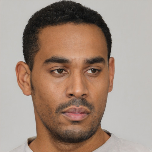 Neutral latino young-adult male with short  black hair and brown eyes