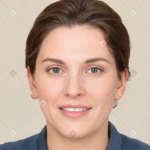 Joyful white young-adult female with short  brown hair and grey eyes