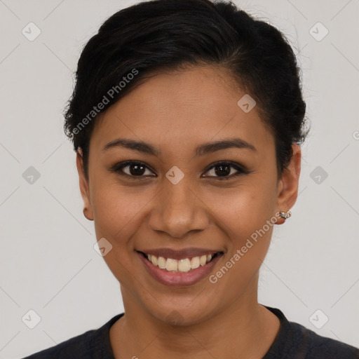 Joyful latino young-adult female with short  brown hair and brown eyes