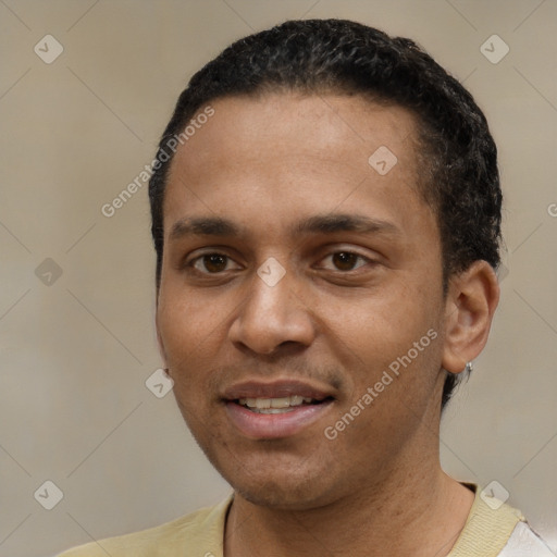 Joyful white young-adult male with short  black hair and brown eyes