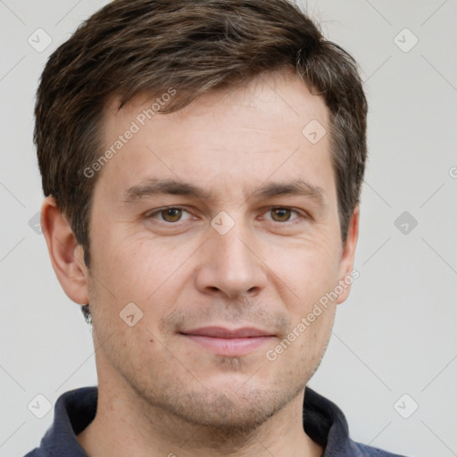 Joyful white adult male with short  brown hair and grey eyes