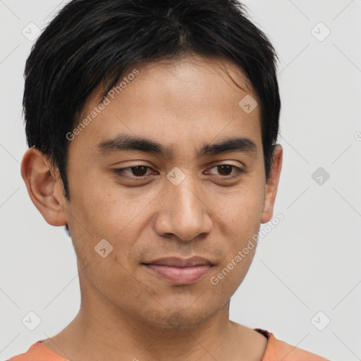 Joyful asian young-adult male with short  brown hair and brown eyes