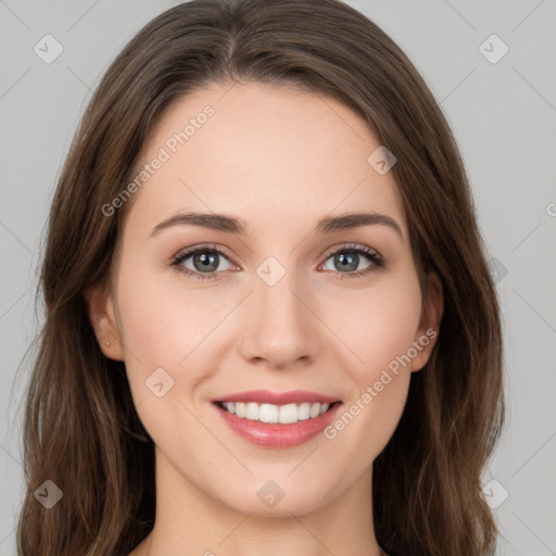 Joyful white young-adult female with long  brown hair and green eyes