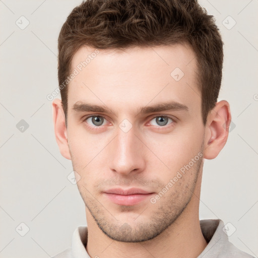 Neutral white young-adult male with short  brown hair and grey eyes