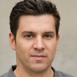 Joyful white young-adult male with short  brown hair and brown eyes