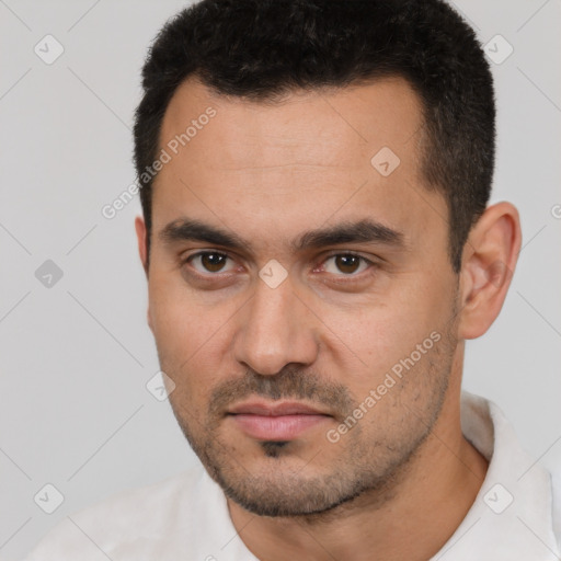Neutral white young-adult male with short  black hair and brown eyes