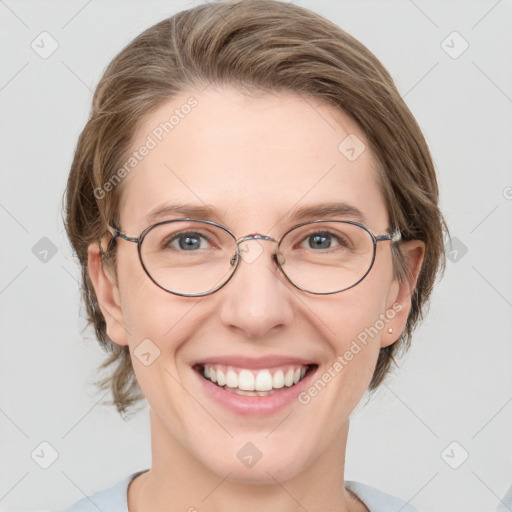 Joyful white adult female with medium  brown hair and blue eyes