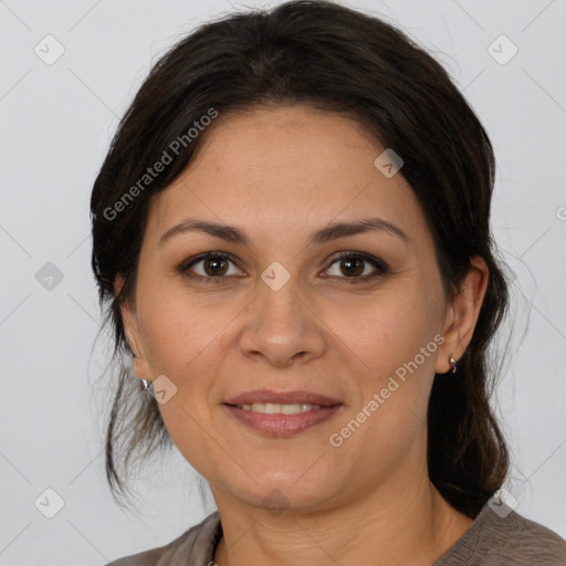 Joyful white adult female with medium  brown hair and brown eyes