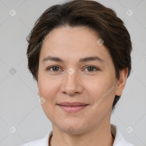 Joyful white adult female with short  brown hair and brown eyes